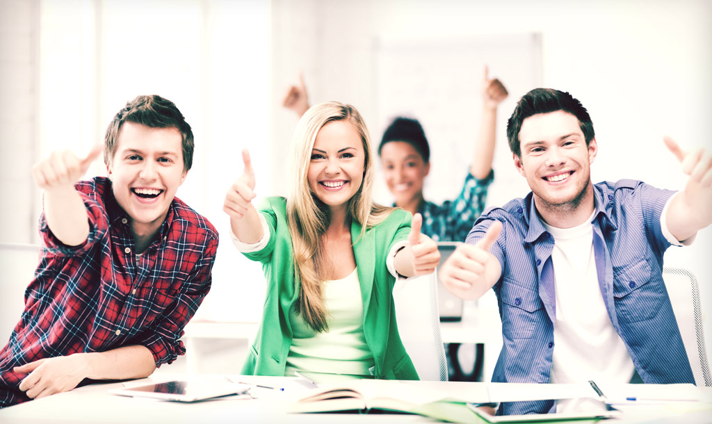 Students showing thumbs up at school